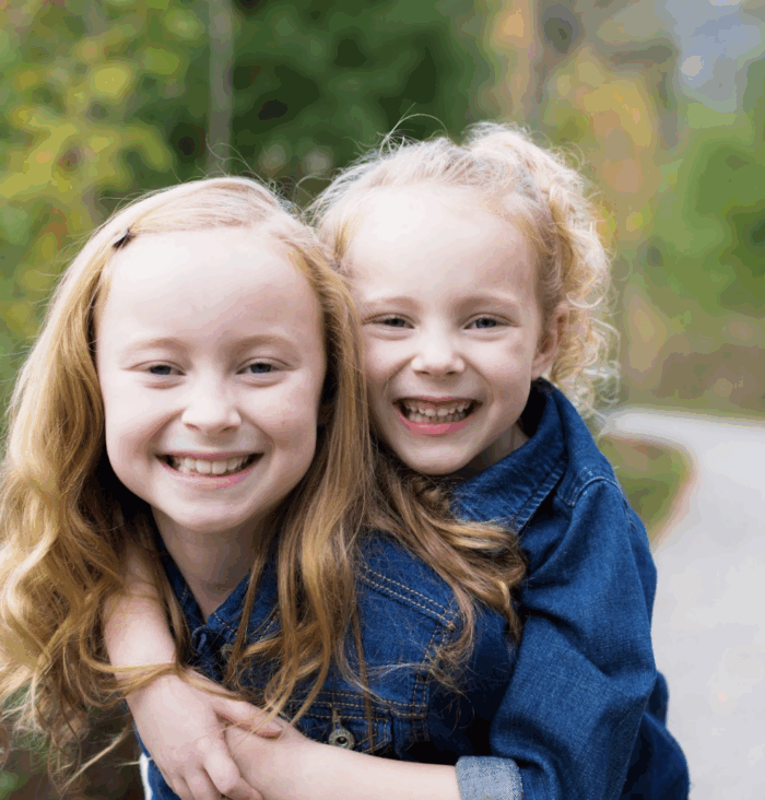 Two sisters hugging at Monon Central Park