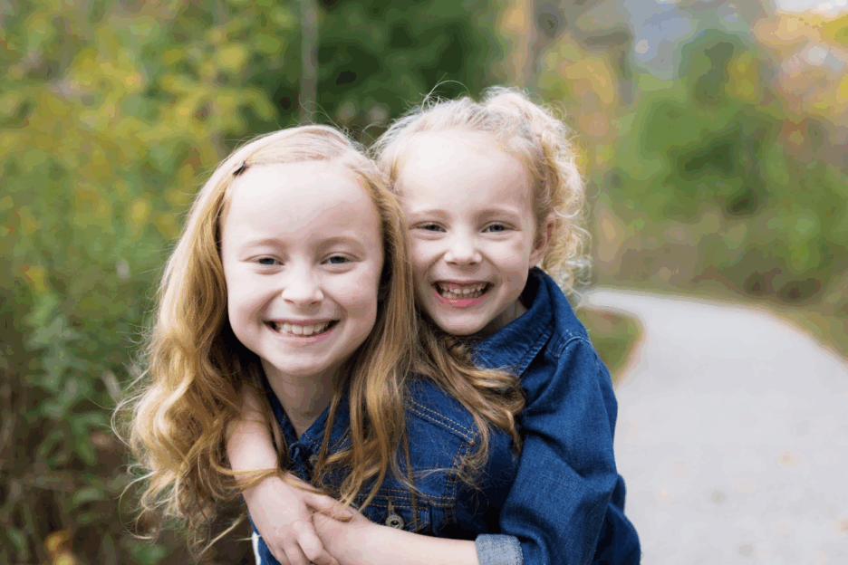 Two sisters hugging at Monon Central Park