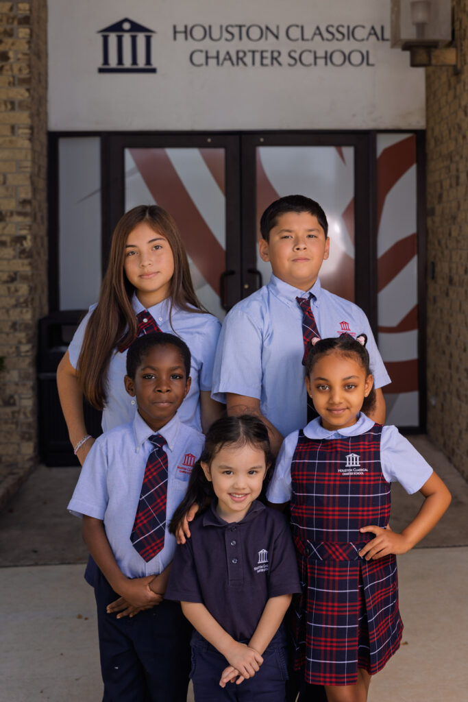 Students outside an entrance to Houston Classical Charter School