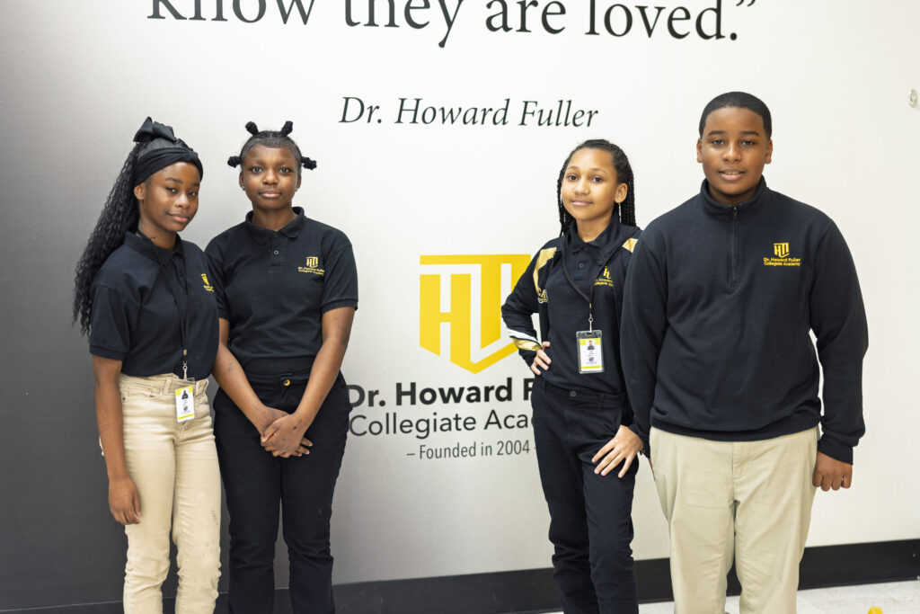 Howard Fuller Collegiate photography capturing students gathered with Dr. Howard Fuller inside the school