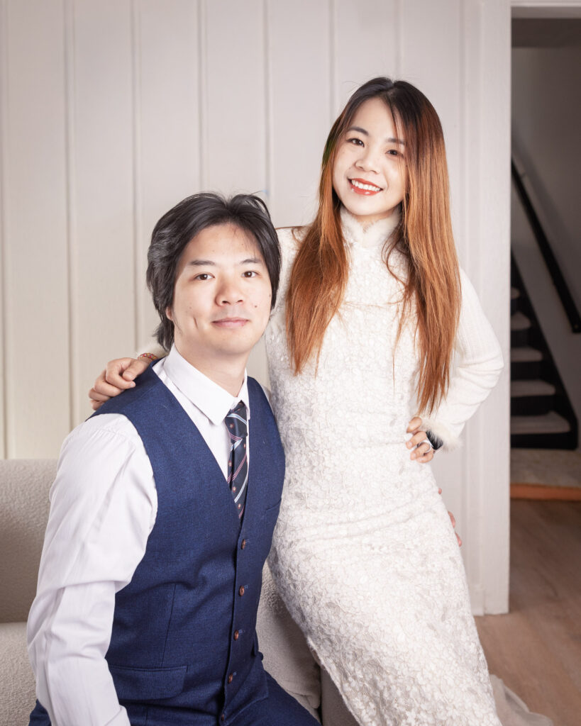 Couple standing together at home during an anniversary family photography session