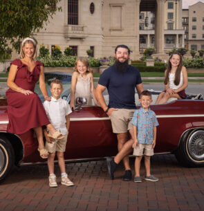 Family portrait in Downtown Carmel Indiana with brick architecture