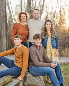 Family portrait in Carmel Indiana wearing coordinated neutral outfits
