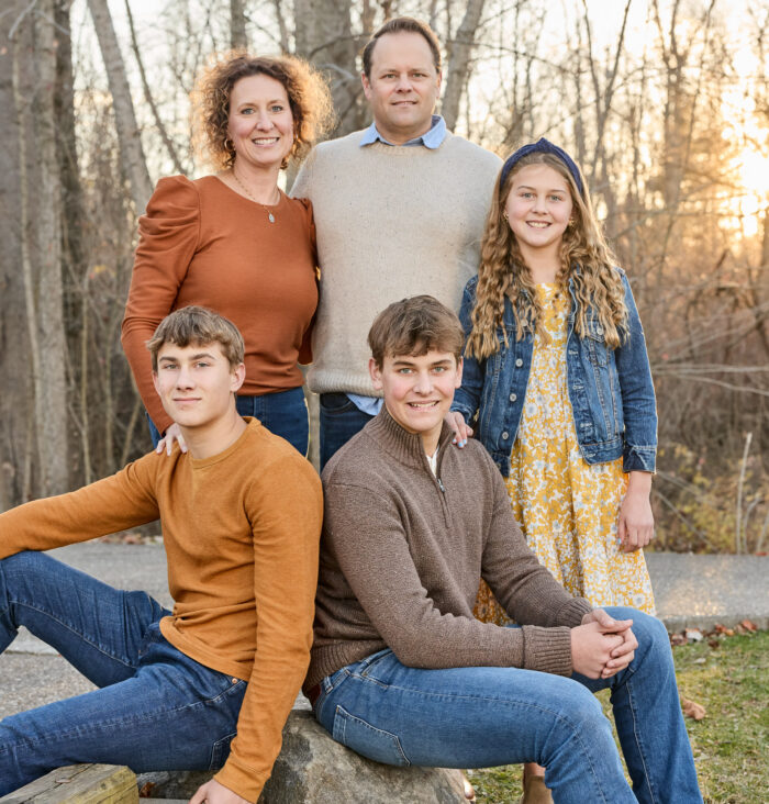 Family portrait in Carmel Indiana wearing coordinated neutral outfits