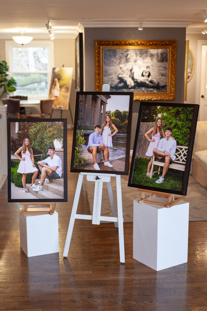 Framed family portrait artwork installed above a sofa in a Carmel home