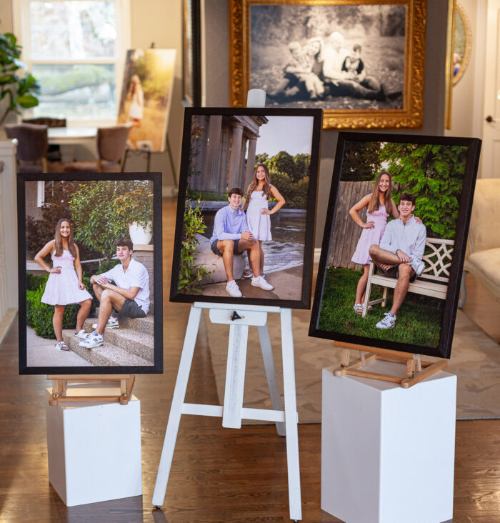 Framed family portrait artwork installed above a sofa in a Carmel home