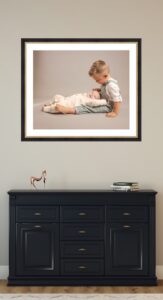 Custom family portrait wall art installed in Carmel Indiana home