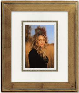 Finished senior portraits displayed as custom wall art in the home