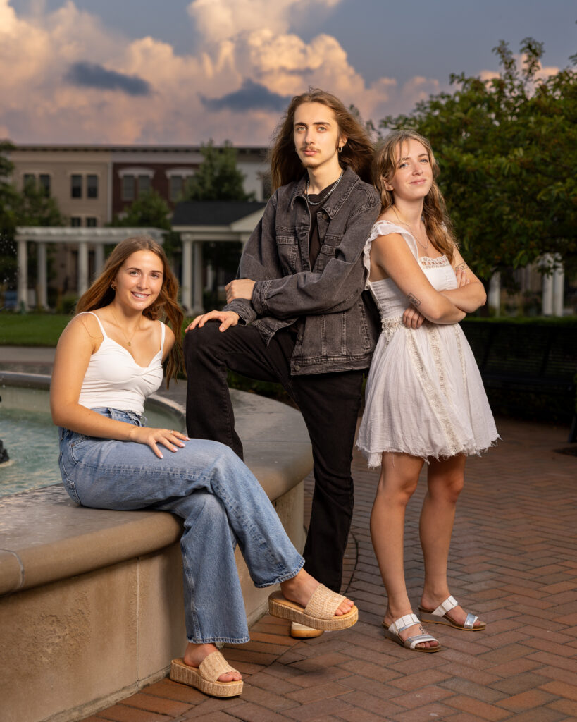 Family photographed outdoors on a summer evening in Carmel Indiana