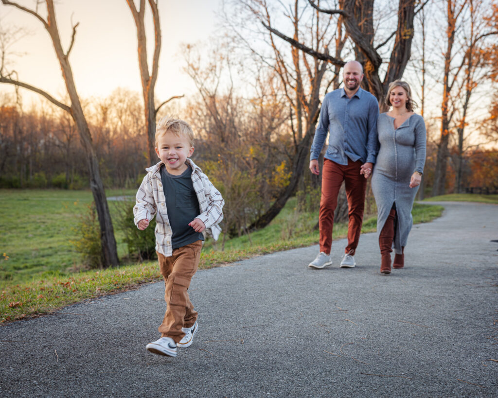 Fall family portrait with warm autumn color in Carmel Indiana