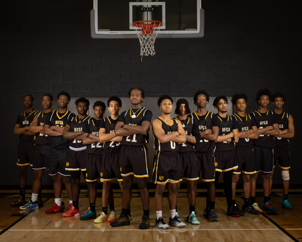 Howard Fuller Collegiate Academy basketball team portrait in the gym